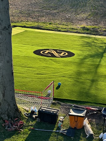 Custom logo inlay on a synthetic turf sports and play field